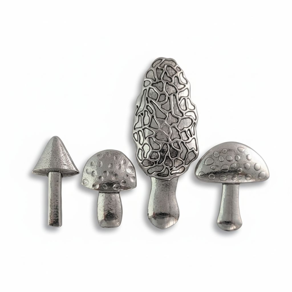 Pewter mushroom measuring spoons on white