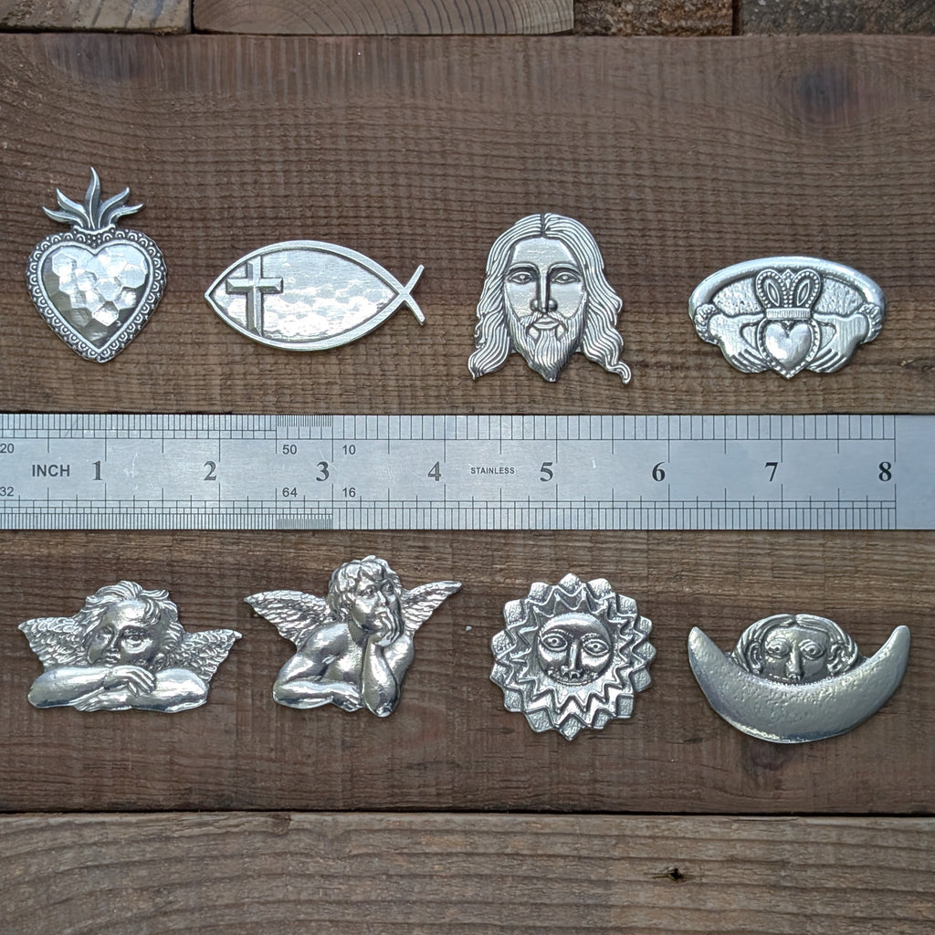 Roosfoos spiritual pewter magnets shown with a ruler for scale