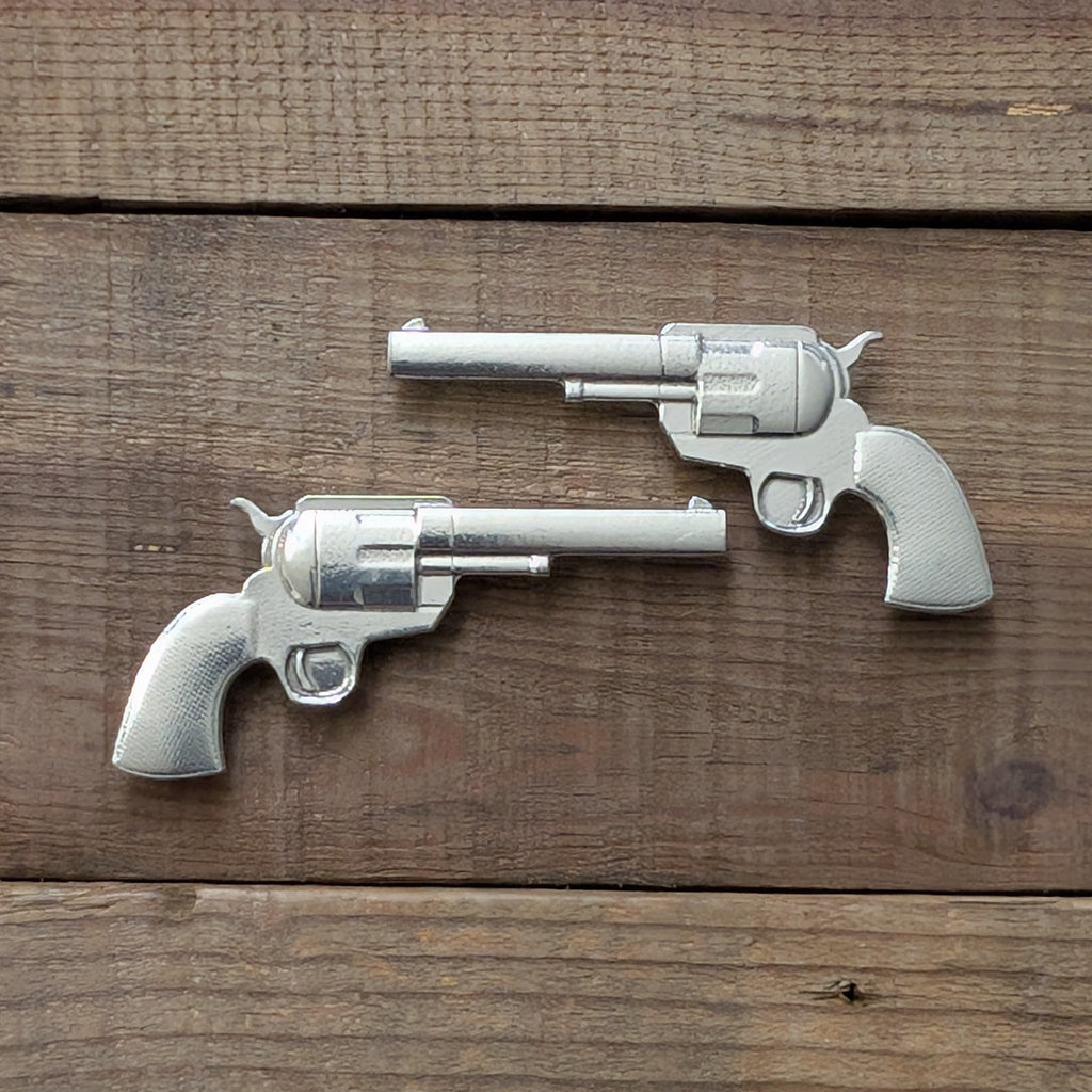 Six Shooters Magnet Pair – alternate view, handmade pewter