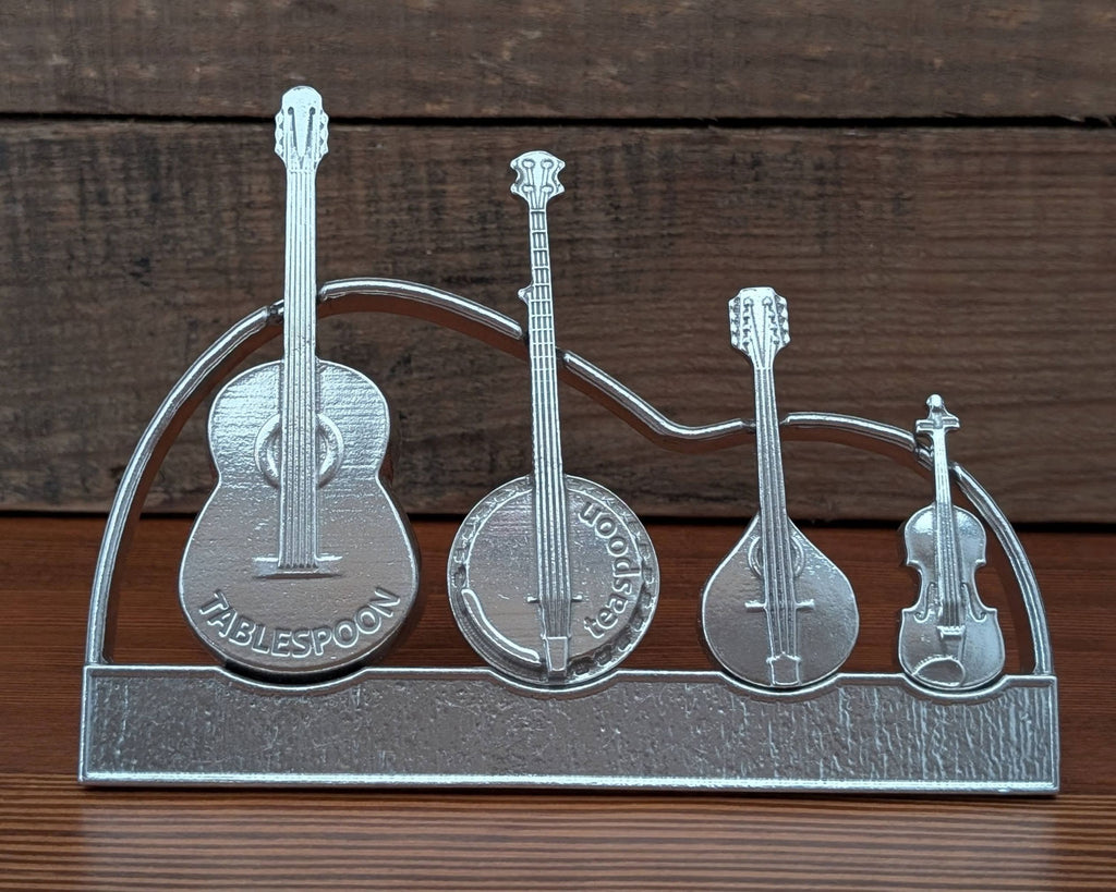 Metallic stand with musical instrument designs on a wooden background