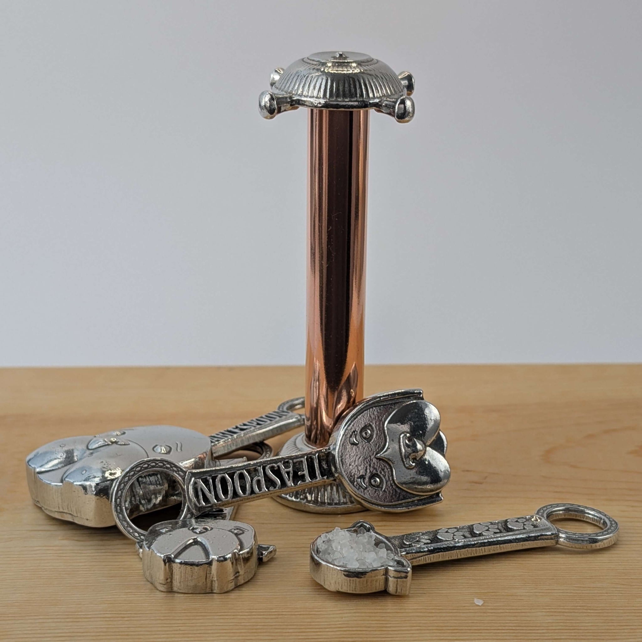 Pewter dog measuring spoons with  copper stand