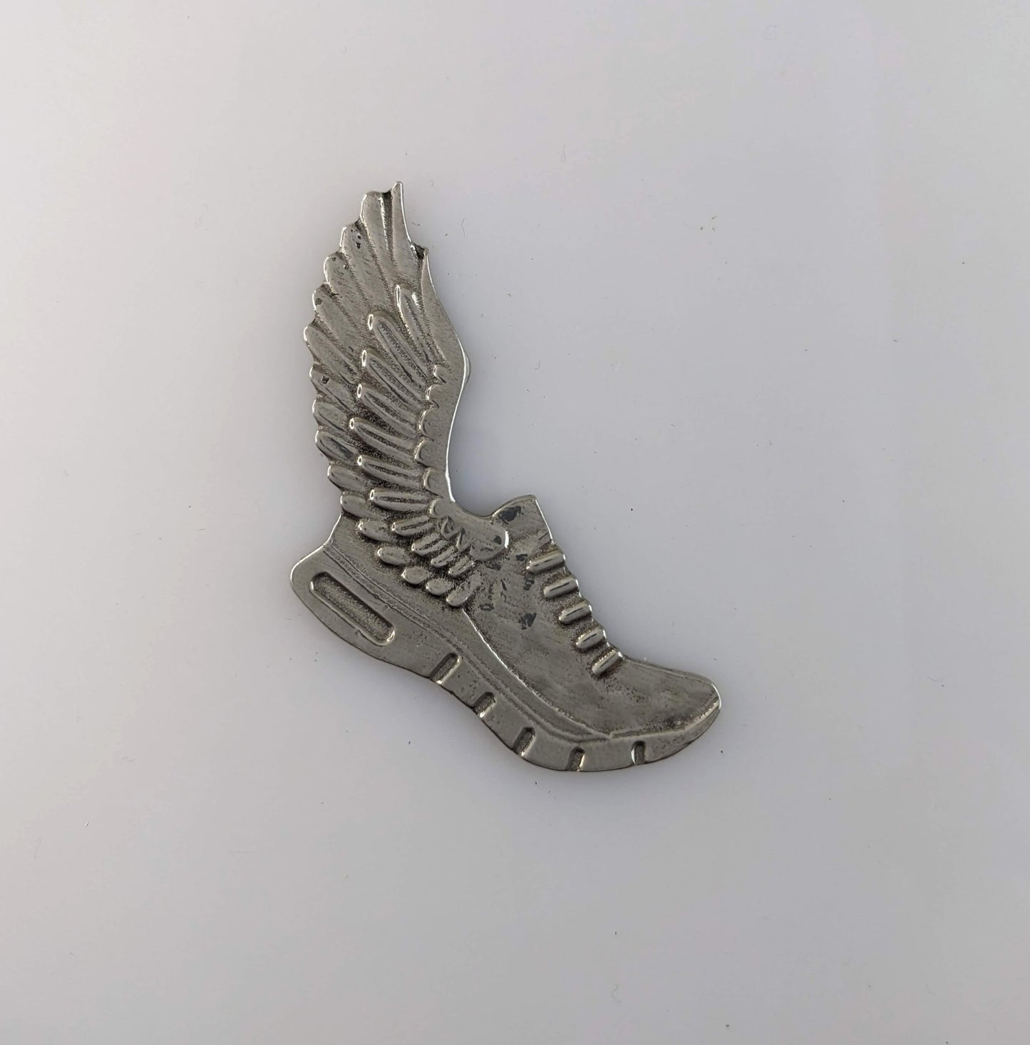 Winged Foot pewter magnet