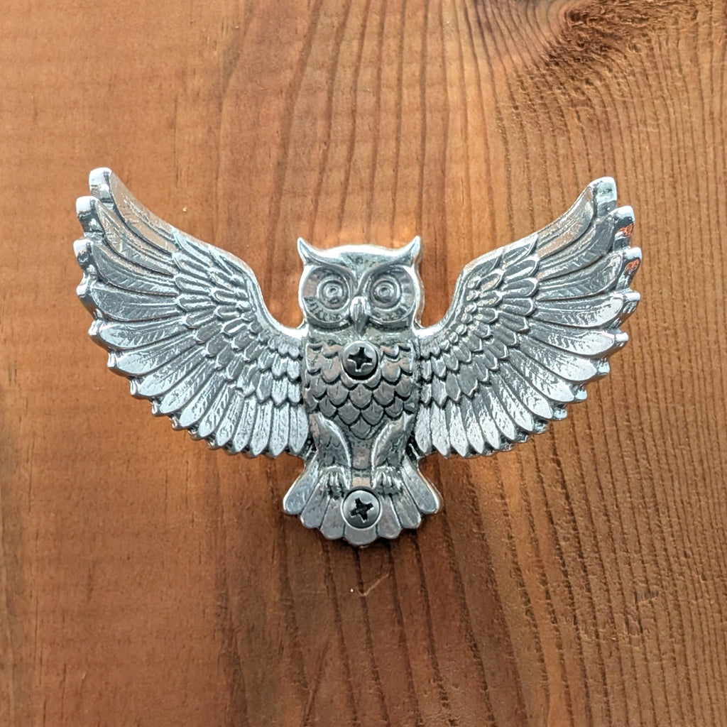 Pewter owl wall hook mounted on a wood board, front view